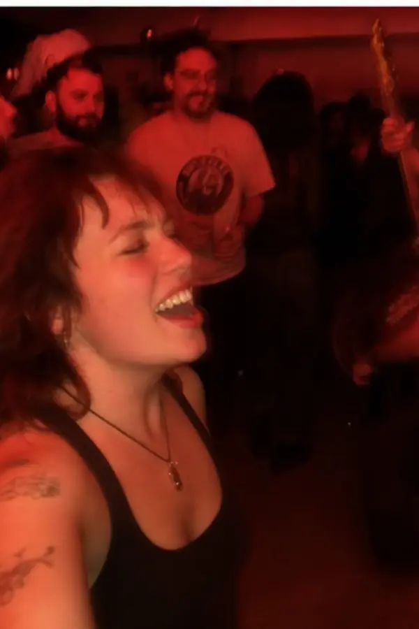 Amélie singing at a tiny concert