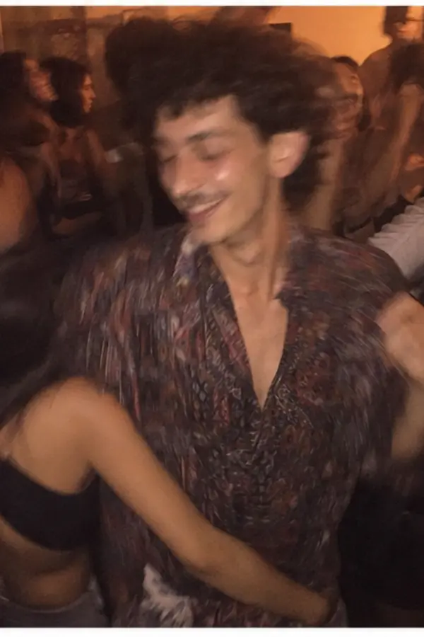 Elio dancing at a house party
