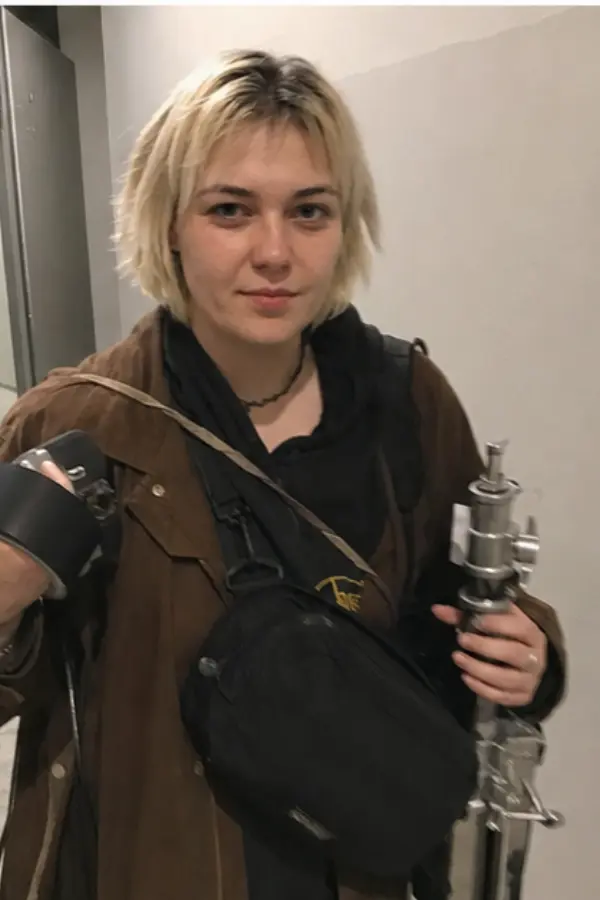Lena carrying event gear