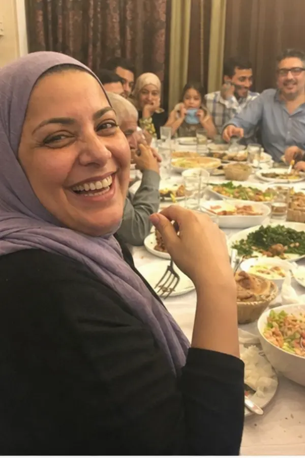 Noor at a crowded family dinner