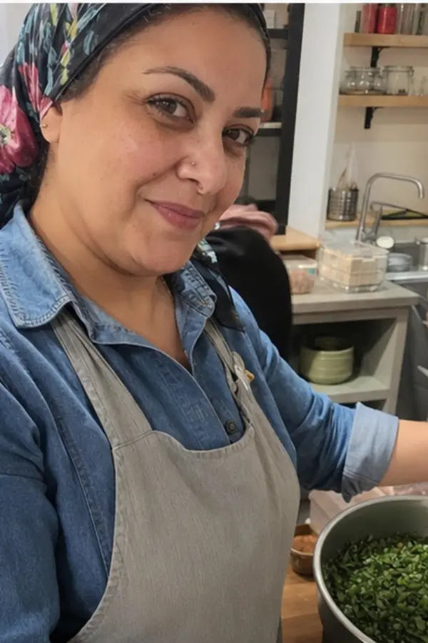 Noor teaching in a kitchen