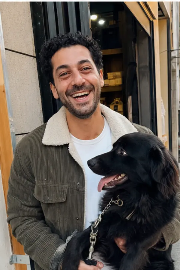 Omar walking a friend’s dog by the sea
