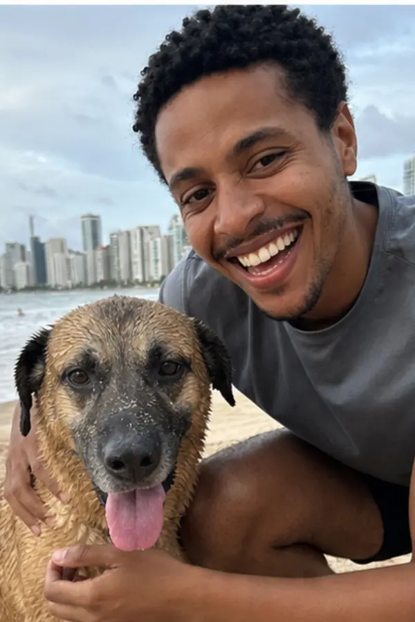 Rafael holding a wet dog