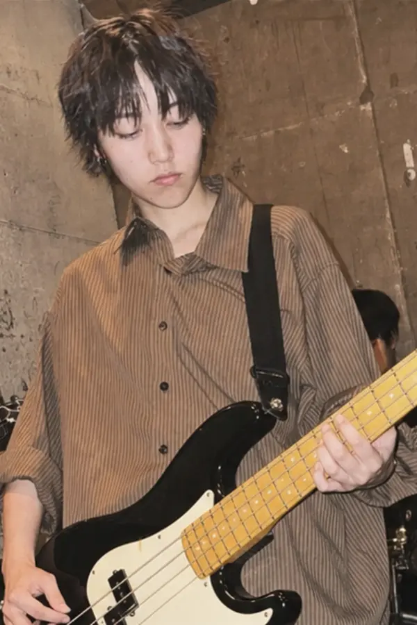 Ren playing bass at rehearsal