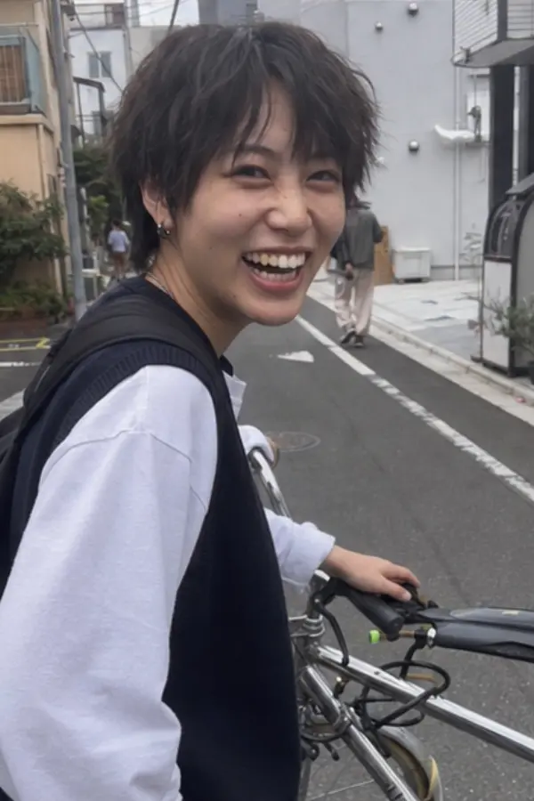 Ren riding a bicycle at night