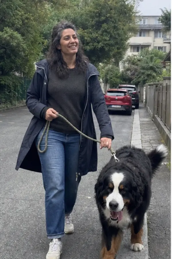 Sofia walking a large dog